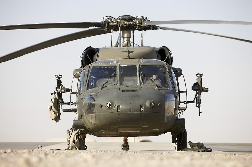 Front view of a UH60L Black Hawk helicopter armed with two 762mm M240B